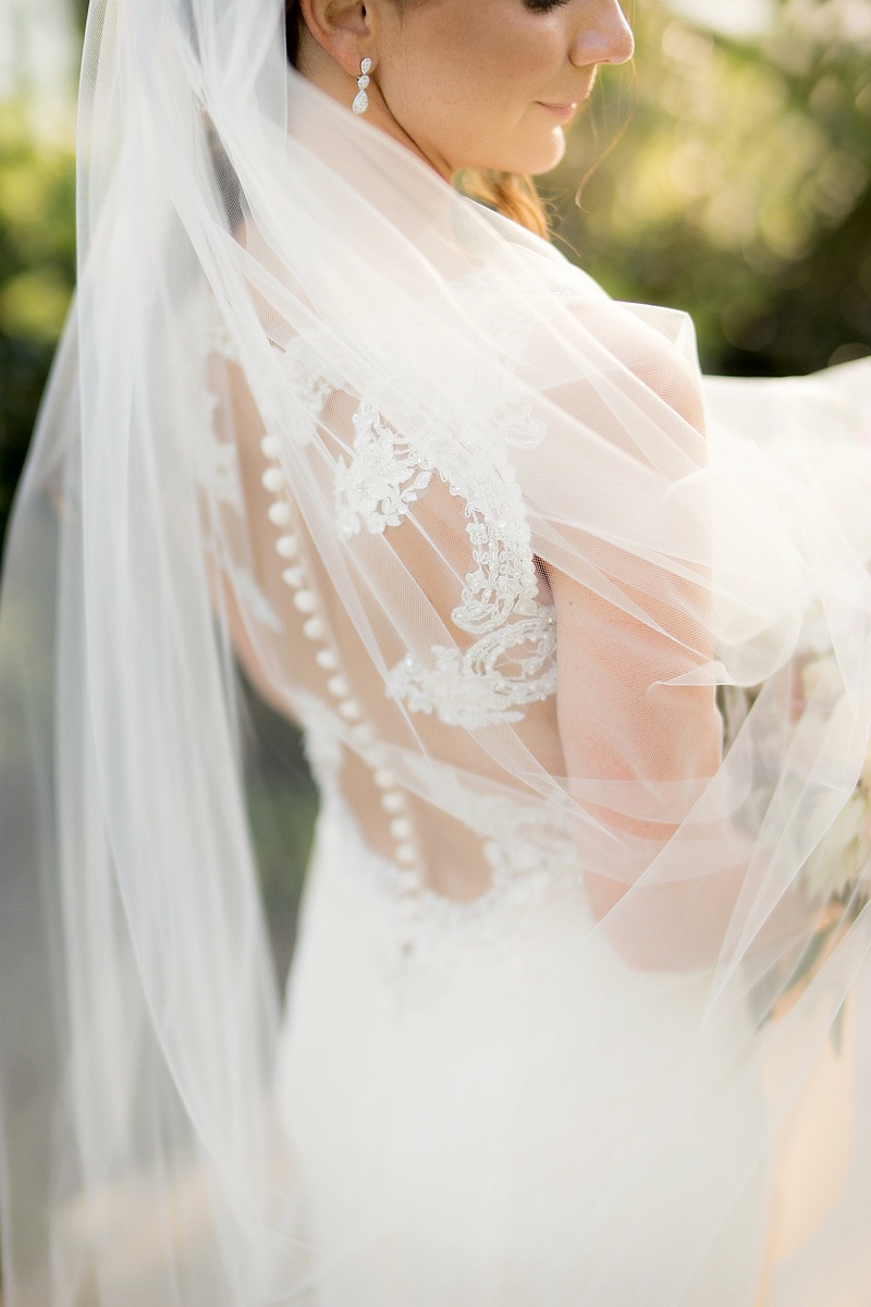 Veil Over Gown with Semi-Illusion Back
Photography: Laurie Bailey Photography
Read More:
http://www.insideweddings.com/weddings/oceanfront-wedding-ceremony-classic-romantic-ballroom-reception/854/ veil over semi illusion back gown wedding buttons lace details