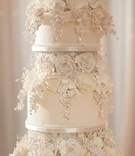 Sugar Flower Cake Detail
Photography: Justin Marantz
Read More:
http://www.insideweddings.com/weddings/unforgettable-miami-wedding-with-acrobats-tiger-cubs-fireworks/437/ Close up of ivory wedding cake with sugar roses