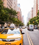 Driver Waves from New York City Cab
Photography: Images by Berit, Inc.
Read More:
http://www.insideweddings.com/weddings/bride-wears-little-black-dress-to-intimate-wedding-in-new-york-city/734/ Driver in a yellow Toyota New York City taxi waves on downtown street