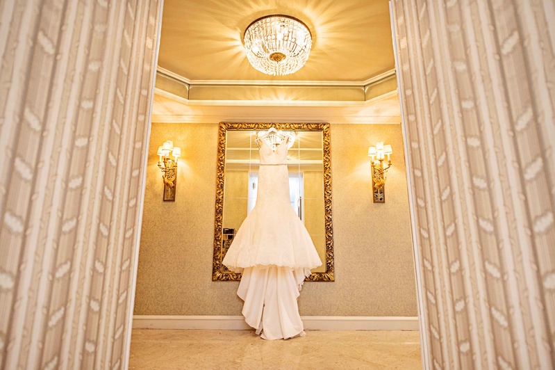 Lace Bridal Gown Hangs In Front of Mirror
Photography: Carasco Photography
Read More:
http://www.insideweddings.com/weddings/new-york-yankees-infielder-marries-in-opulent-chicago-soiree/764/ matthew christopher winslet lace trumpet v-neck gown