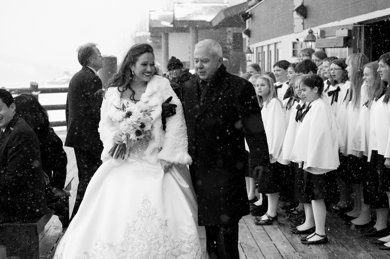 Ceremony Choir
Photography: Handeland Tesoro Photography
Read More:
http://www.insideweddings.com/weddings/snowy-outdoor-winter-ceremony-cozy-lodge-reception/522/ Black and white photo of bride walking with father
