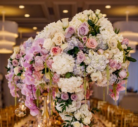 Centerpiece Covered with Florals
Photography: Amy Anaiz Photography
Read More:
http://www.insideweddings.com/weddings/luxe-springtime-wedding-inspiration-shoot-with-delectable-desserts/1120/ Wedding table candles gold riser with white purple pink flowers rose hydrangea greenery orchid