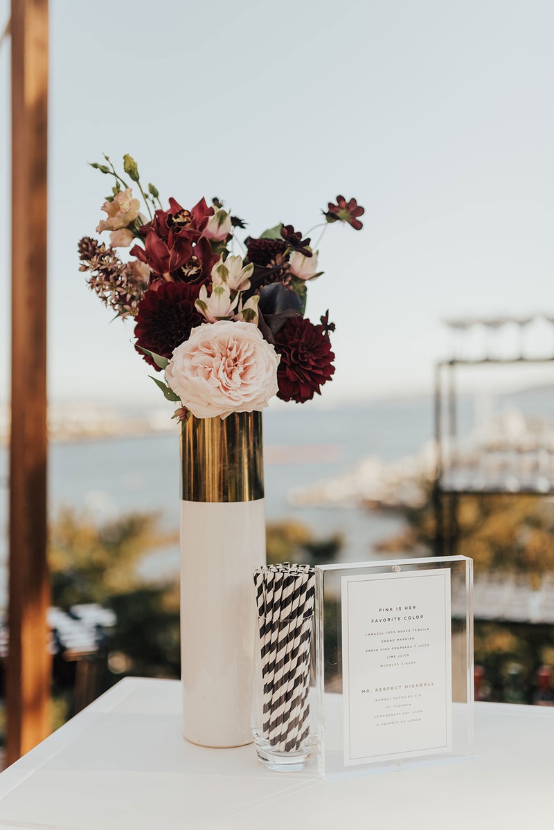 Black, White, Gold %26 Burgundy Bar Décor
Photography: Sam %26 Sola Lee Photography
Read More:
http://www.insideweddings.com/weddings/modern-outdoor-ceremony-tent-reception-in-seattle-on-puget-sound/1309/ outdoor cocktail hour pink and burgundy rose flowers dahlia white gold vase black white stripe straw