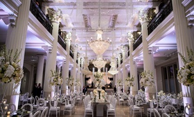 Gorgeous Ballroom Reception with Chandeliers
Photography: Chris Bailey Photography
Read More:
http://www.insideweddings.com/weddings/modern-elegant-ballroom-wedding-with-white-flowers-in-houston/1246/ wedding reception at the corinthian in houston white columns purple lighting white flowers modern