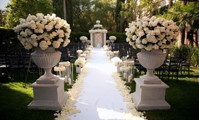 Ivory Floral Arrangements
Photography: John Solano Photography
Read More:
http://www.insideweddings.com/weddings/romantic-california-wedding-with-deep-red-details/318/ Stone pedestals filled with roses and hydrangeas
