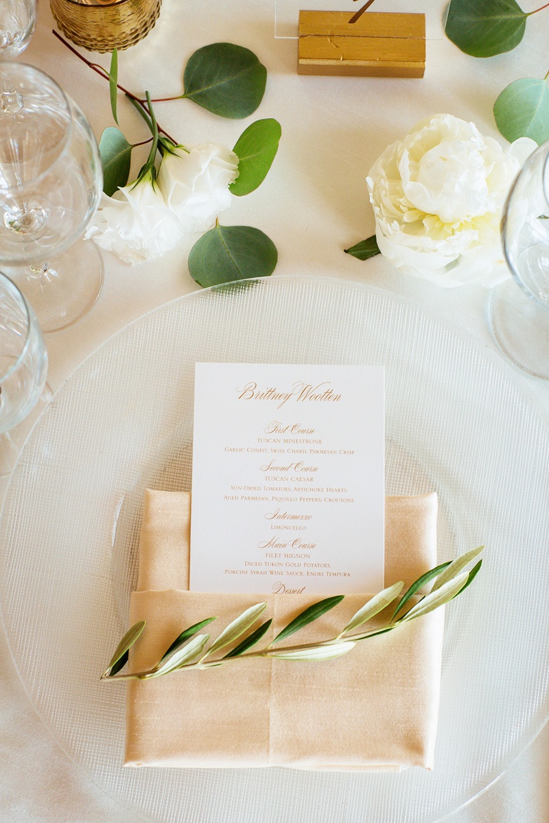 Sprig of Olive on Place Setting
Photography: Chard Photo
Read More:
http://www.insideweddings.com/weddings/alfresco-ceremony-on-the-coast-classic-ballroom-reception/1290/ place setting with neutral hued napkin, olive sprig, menu