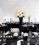 Sequin Black %26 White Wedding Table
Photography: Kortnee Kate
Read More:
http://www.insideweddings.com/weddings/black-and-white-modern-wedding-with-unique-details-in-cincinnati/698/ Black sequin tablecloth with tall black centerpiece and white flowers