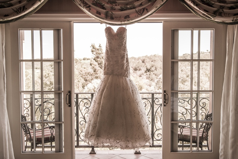 Beaded Mermaid Gown in Window
Photography: Boyd Harris Photographs
Read More:
http://www.insideweddings.com/weddings/a-jeweled-floral-wedding-at-fairmont-grand-del-mar-in-san-diego/745/ Romona Keveza beaded mermaid wedding dress hangs in window of Grand Del Mar