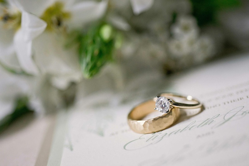Gold Wedding Rings
Photography: Harwell Photography
Read More:
http://www.insideweddings.com/weddings/romantic-woodland-inspired-atlanta-wedding-with-natural-details/433/ Gold hammered men's band and solitaire engagement ring