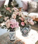 Painted Vintage-Inspired Vases
Photography: Belle Ombre Photography
Read More:
http://www.insideweddings.com/weddings/vintage-bohemian-inspired-wedding-on-historic-bridge-in-cleveland/1373/ wedding reception lounge area vintage area rug painted vase pink flowers greenery