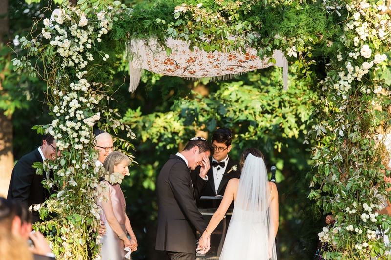 Groom Gets Emotional During Ceremony
Photography: Vue Photography
Read More:
http://www.insideweddings.com/weddings/summer-destination-wedding-with-rustic-elegant-decor-in-georgia/1032/ Wedding ceremony greenery woods area with groom touching eyes parents on both sides Jewish ceremony