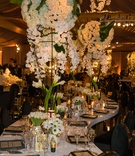 Serpentine Table with Tall Centerpieces
Photography: Curtis Dahl Photography
Read More:
http://www.insideweddings.com/weddings/luxury-wedding-with-an-art-deco-theme-in-southern-california/1122/ Wedding reception white lacquer table winding gold black place settings white centerpieces