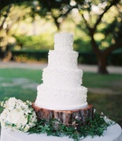 Wedding Cake
Photography: Jose Villa Photography
Read More:
http://www.insideweddings.com/weddings/california-oceanside-wedding-with-natural-elements/286/ White wedding cake with white sugar flowers on tree trunk
