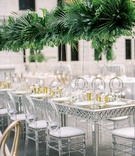 Lucite Chair at Silver %26 Mirror Table
Photography: Lauren Gabrielle Photography
Read More:
http://www.insideweddings.com/weddings/summer-real-wedding-featuring-tropical-decor-at-an-art-museum/1328/ wedding reception long silver and mirror table with oval lucite acrylic chairs tall tropical