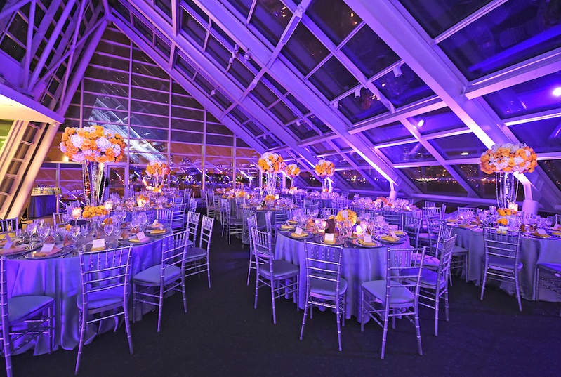 Reception at Adler Planetarium
Photography: Carasco Photography
Read More:
http://www.insideweddings.com/weddings/city-wedding-at-chicago-planetarium-with-purple-yellow-palette/688/ Wedding reception with purple lighting, lilac satin linens, yellow roses, white hydrangeas