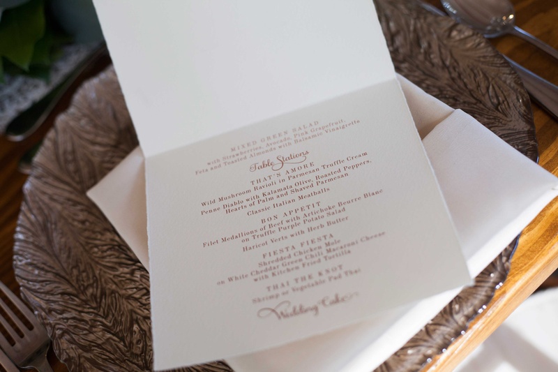 White Fold-Over Menu with Gold Calligraphy
Photography: Michael Bambino %26 Co.
Read More:
http://www.insideweddings.com/weddings/whimsical-open-air-secret-garden-wedding-with-soft-spring-hues/777/ a white card with a couples reception menu in gold calligraphy
