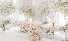 Lush Sweetheart Table Near Cake
Photography: Rene Zadori Photography
Read More:
http://www.insideweddings.com/weddings/opulent-wedding-with-classic-winter-white-color-scheme/1233/ lush florals covering gold sweetheart table, full trees of florals