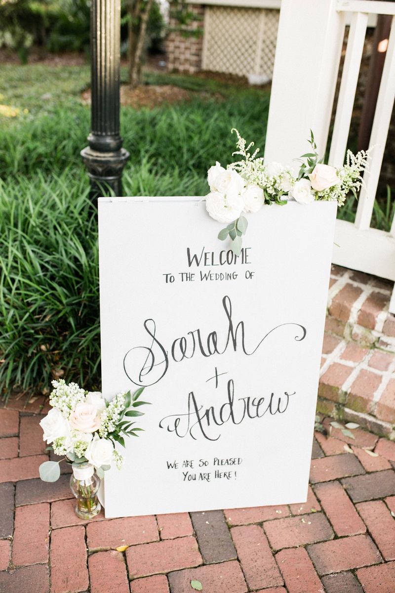 Handwritten Wedding Welcome Sign
Photography: Vitor Lindo Photo + Video
Read More:
http://www.insideweddings.com/weddings/soft-romantic-spring-destination-wedding-in-south-carolina/1285/ wedding welcome sign on brick floor outdoors white flowers greenery decorations hand written text