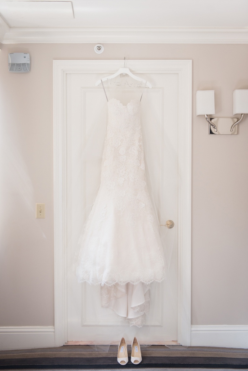 Wedding Dress Hung Up on Door
Photography: Ira Lippke Studios
Read More:
http://www.insideweddings.com/weddings/chic-classic-new-york-city-wedding-with-personal-touches/783/ white lace Monique Lhuillier wedding dress with sweetheart neckline and trumpet-style skirt
