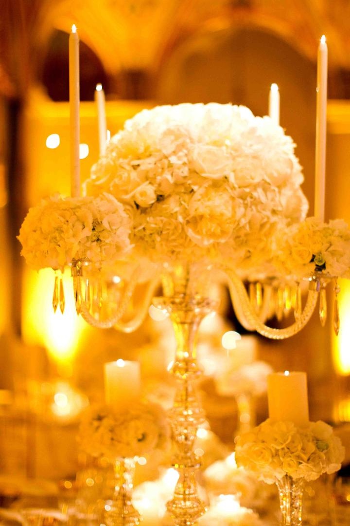 Crystal Candelabra Centerpiece
Photography: Donna Newman Photography
Read More:
http://www.insideweddings.com/weddings/elegant-all-white-wedding-at-the-breakers-in-florida/362/ Fancy wedding decorations candleholder with white flowers