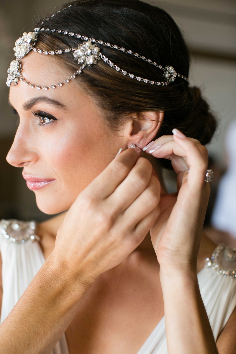 Bride Putting on Earrings %26 Headpiece
Photography: Samuel Lippke Studios
Read More:
http://www.insideweddings.com/weddings/a-rustic-camp-themed-outdoor-wedding/908/ Bride putting on earrings French manicure headdress of jewels and flower details