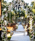 Dramatic Ceremony Entrance Arch
Photography: Jay Lawrence Goldman Photography
Read More:
http://www.insideweddings.com/weddings/rustic-vintage-outdoor-ceremony-tent-reception-in-palm-springs/692/ Flower arch with "This is How Our Story Begins" sign
