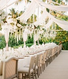 Reception Décor
Photography: KT Merry Photography
Read More:
http://www.insideweddings.com/weddings/a-gorgeous-and-elegant-outdoor-florida-wedding/536/ Wedding reception with a long table under suspended floral arrangements and chandeliers