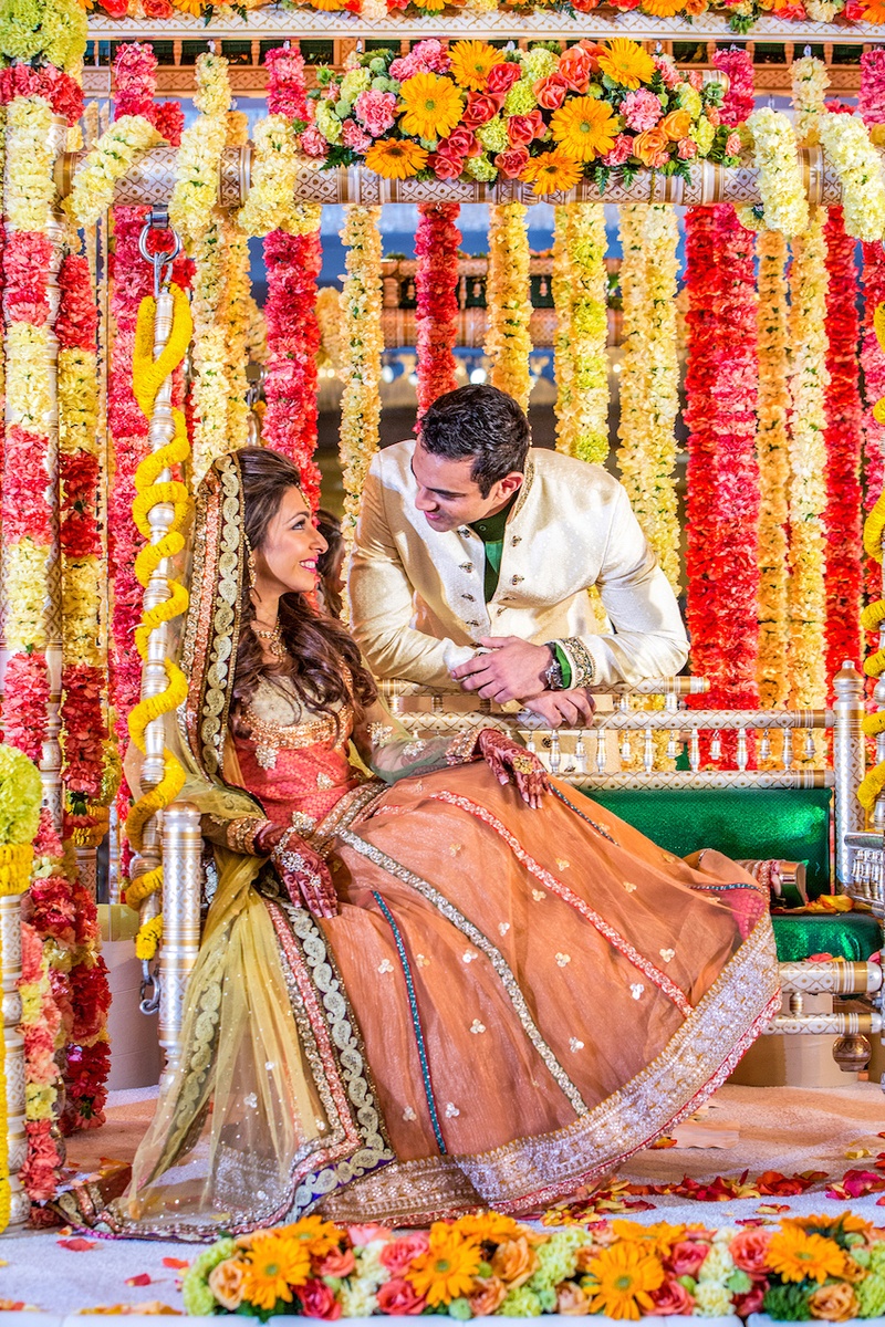 Couple at Pre-Wedding Ceremony
Photography: Yogi Patel - Global Photography
Read More:
http://www.insideweddings.com/weddings/indian-wedding-with-vibrant-colors-and-gorgeous-red-roses/639/ Indian bride and groom amid vibrant flower garlands