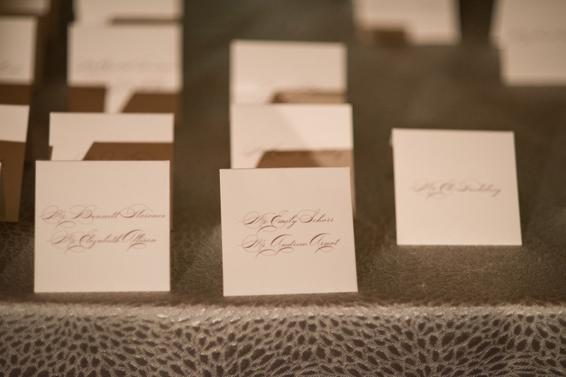 White Escort Cards with Grey Calligraphy
Photography: Ira Lippke Studios
Read More:
http://www.insideweddings.com/weddings/chic-classic-new-york-city-wedding-with-personal-touches/783/ small white escort cards with names written in gray calligraphy