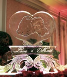 Heart-Shaped Ice Sculpture
Photography: Lawrence Crandall Photography
Read More:
http://www.insideweddings.com/weddings/alice-in-wonderland-queen-of-hearts-themed-wedding/83/ Ice sculpture engraved with photo of bride and groom