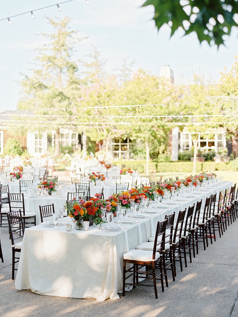 Long Wedding Table with Low Centerpiece Runner
Photography: Ryan Ray Photography
Read More:
http://www.insideweddings.com/weddings/outdoor-wedding-with-vibrant-pink-orange-decor-in-california/723/ Long wedding table at private residence of bride's parents and long farm table decorations