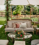 Antique Lounge Under Tent in Garden
Photography: Our Two Hearts
Read More:
http://www.insideweddings.com/weddings/romantic-whimsical-outdoor-garden-wedding-reception-inspiration/1319/ wedding reception upholstered stool coffee table pink orange yellow flowers settee sofa dusty rose