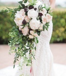 Brimming, Cascading Bouquet with Light, Dark Flowers
Photography: Brandon Kidd Photography
Read More:
http://www.insideweddings.com/weddings/vibrant-alfresco-ceremony-ballroom-reception-in-newport-beach-ca/951/ brimming cascading bouquet light dark flowers juxtapose arrangement vines roses black greenery blush