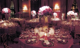 Reception Table Decor
Photography: Joe Buissink Photography
Read More:
http://www.insideweddings.com/weddings/fall-greek-orthodox-wedding-ceremony-in-los-angeles-california/127/ Round reception tables decorated with red, lavender, and fuchsia roses in a tall glass vase