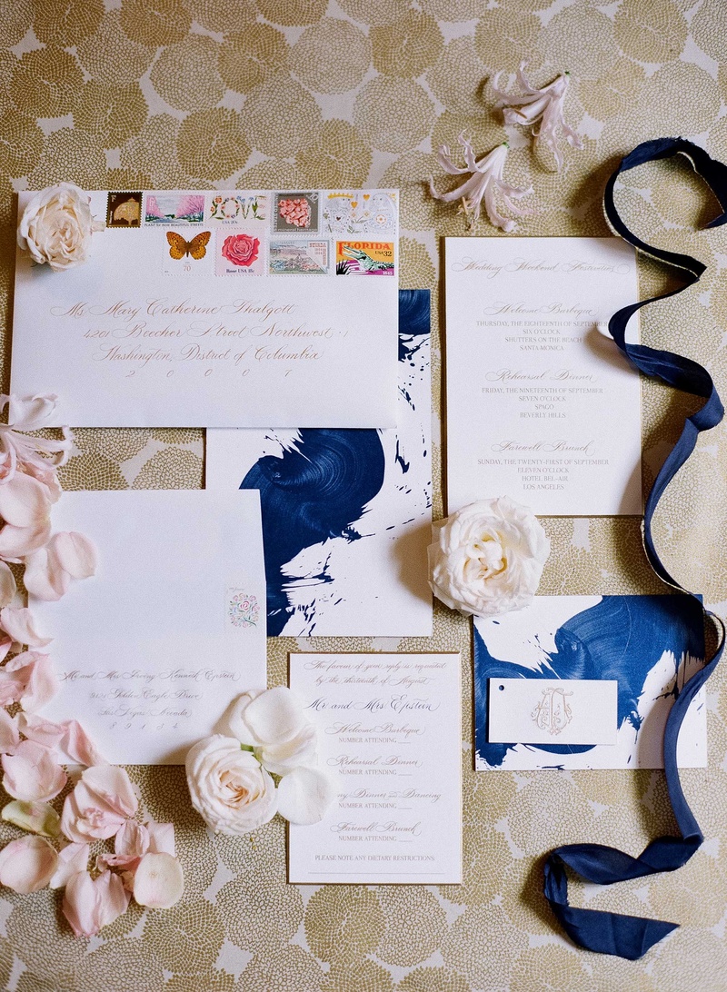 Blue Paint Stroke Invitation
Photography: Mi Belle Photographers
Read More:
http://www.insideweddings.com/weddings/colorful-outdoor-wedding-with-supper-club-theme-in-los-angeles-ca/741/ Storkie Express wedding invitation suite with blue paint brush stroke design and stamps