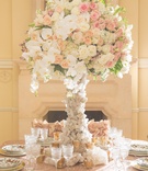 Pink, White %26 Peach Centerpiece on Quartz Stand
Photography: Thisbe Grace Photography
Read More:
http://www.insideweddings.com/weddings/inspirational-wedding-shoot-inspired-by-geology-glam-textures/678/ Wedding reception table with white, pink, peach roses, orchids, asiatic lilies on quartz stand