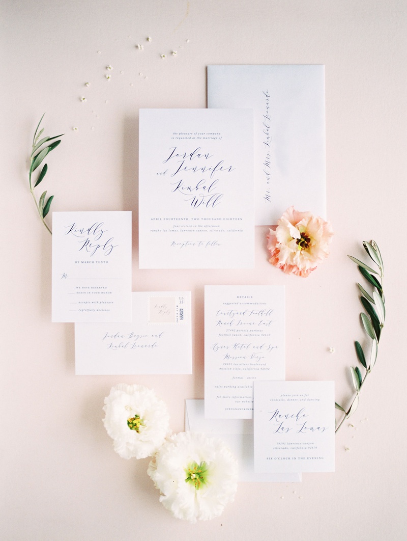Romantic Calligraphy Invitation
Photography: Anya Kernes Photography
Read More:
http://www.insideweddings.com/weddings/outdoor-wedding-with-dusty-rose-powder-blue-lavender-palette/1288/ wedding invitation suite detail shot with flowers pink white greenery flower petals stamps minted