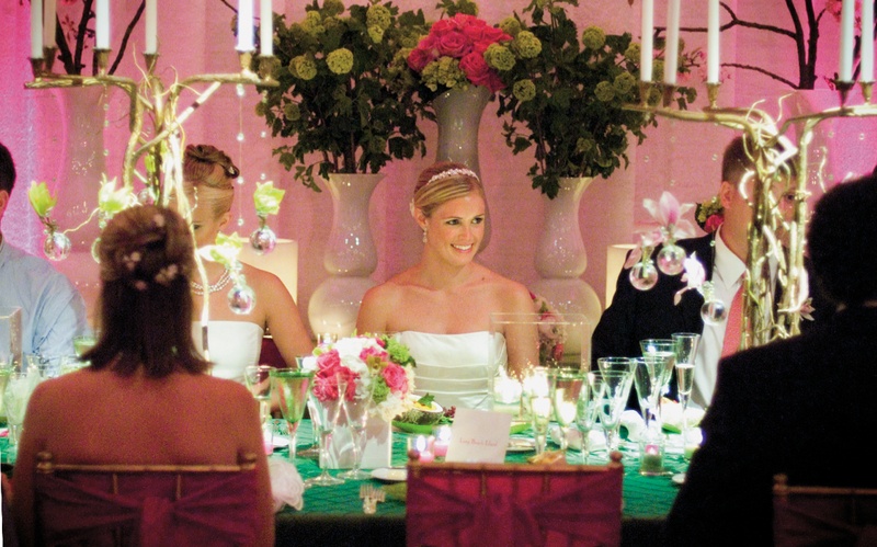 Bride at Reception Table
Photography: Mermin + Christie Photographers
Read More:
http://www.insideweddings.com/weddings/tropical-theme-beach-wedding-in-naples-florida/184/ bride sits at table decorated with green linens and candelabras made of branches