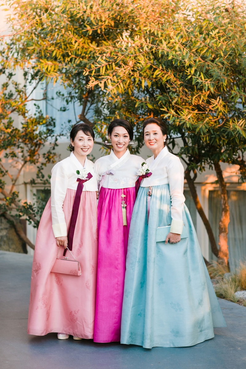 Bride with Mother in Traditional Attire
Photography: Michelle Beller Photography
Read More:
http://www.insideweddings.com/weddings/classic-ceremony-beachfront-ballroom-reception-in-santa-monica/1234/ bride with female family members mother in traditional korean wedding attire hanbok in pink and blue