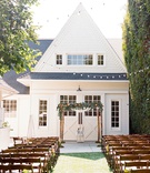 Outdoor Ceremony at Farmhouse Venue
Photography: Braedon Photography
Read More:
http://www.insideweddings.com/weddings/colorful-wedding-featuring-a-punchy-peach-palette/1173/ Wedding ceremony outside string lights wood branch chuppah greenery renovated victorian farmhouse