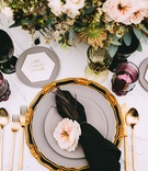 Aerial View of Contemporary Table
Photography: Aesthetiica Photography
Read More:
http://www.insideweddings.com/weddings/modern-fall-wedding-with-courtyard-ceremony-rooftop-reception/1069/ Wedding reception top view black napkin pink flower gold flatware hexagon marble name plate colors