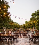 Bistro Lights Over Courtyard
Photography: Julieta Amezcua Photography
Read More:
http://www.insideweddings.com/weddings/outdoor-destination-wedding-with-modern-day-details-in-mexico/1213/ dark wood tables and chairs with trees, bistro lights, courtyard wedding reception, unique tile