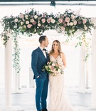 Newlyweds Under Chuppah
Photography: Aga Jones Photography
Read More:
http://www.insideweddings.com/weddings/jewish-ceremony-on-terrace-modern-bay-view-reception-in-san-diego/1323/ groom in cobalt blue suit looking at bride as they stand under chuppah with roses in shades of pink