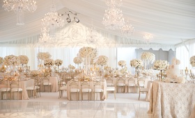 Elegant Neutral Reception
Photography: Aaron Delesie Photographer
Read More:
http://www.insideweddings.com/weddings/elegant-all-white-country-club-wedding-with-natural-greenery/530/ Tent wedding reception with white flowers and gold chairs