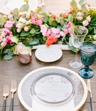 Colorful Place Setting at Outdoor Venue
Photography: Jodee Debes Photography
Read More:
http://www.insideweddings.com/weddings/outdoor-ceremony-reception-with-bright-color-palette-at-la-ranch/1280/ wood table gold black flatware gold charger plate blush napkin blue goblet pink orange flowers green