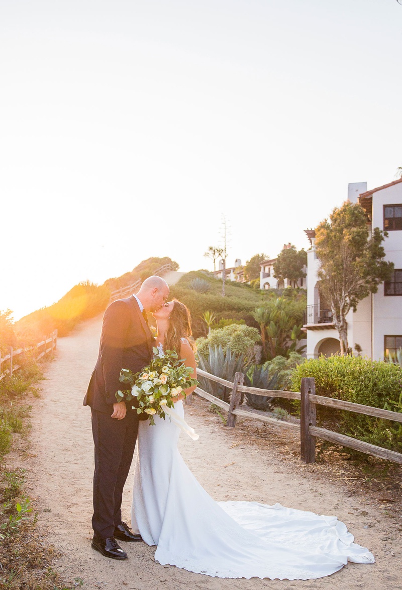 Santa Barbara Sunset Portrait
Photography: Willa Kveta Photography
Read More:
http://www.insideweddings.com/weddings/destination-wedding-in-santa-barbara-with-california-sunshine-theme/1310/ bride in wedding dress bella bianca bridal couture large bouquet kiss groom sunset golden hour