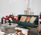 kentucky derby themed bridal shower, emerald couch, leather pillow, cow skin rug, red and pink roses