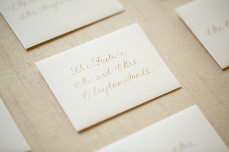 Gold Calligraphy Escort Cards
Photography: Aaron Watson Photography
Read More:
http://www.insideweddings.com/weddings/classic-virginia-wedding-inspired-by-grace-kellys-elegance/511/ White stationery seating cards with handwritten gold names