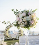 Blush %26 Ivory Ocean-View Ceremony
Photography: Palos Studio
Read More:
http://www.insideweddings.com/weddings/ocean-view-ceremony-classic-reception-with-soft-blue-color-scheme/1371/ wedding ceremony pink rose white hydrangea greenery arrangement circle arch flower petal aisle