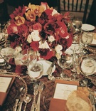Brown %26 Burgundy Tablescape
Photography: Simone %26 Martin Photography
Read More:
http://www.insideweddings.com/weddings/multicultural-winter-wedding-at-a-sophisticated-venue-in-california/75/ Gold plates on brown tablecloth with red flower centerpiece